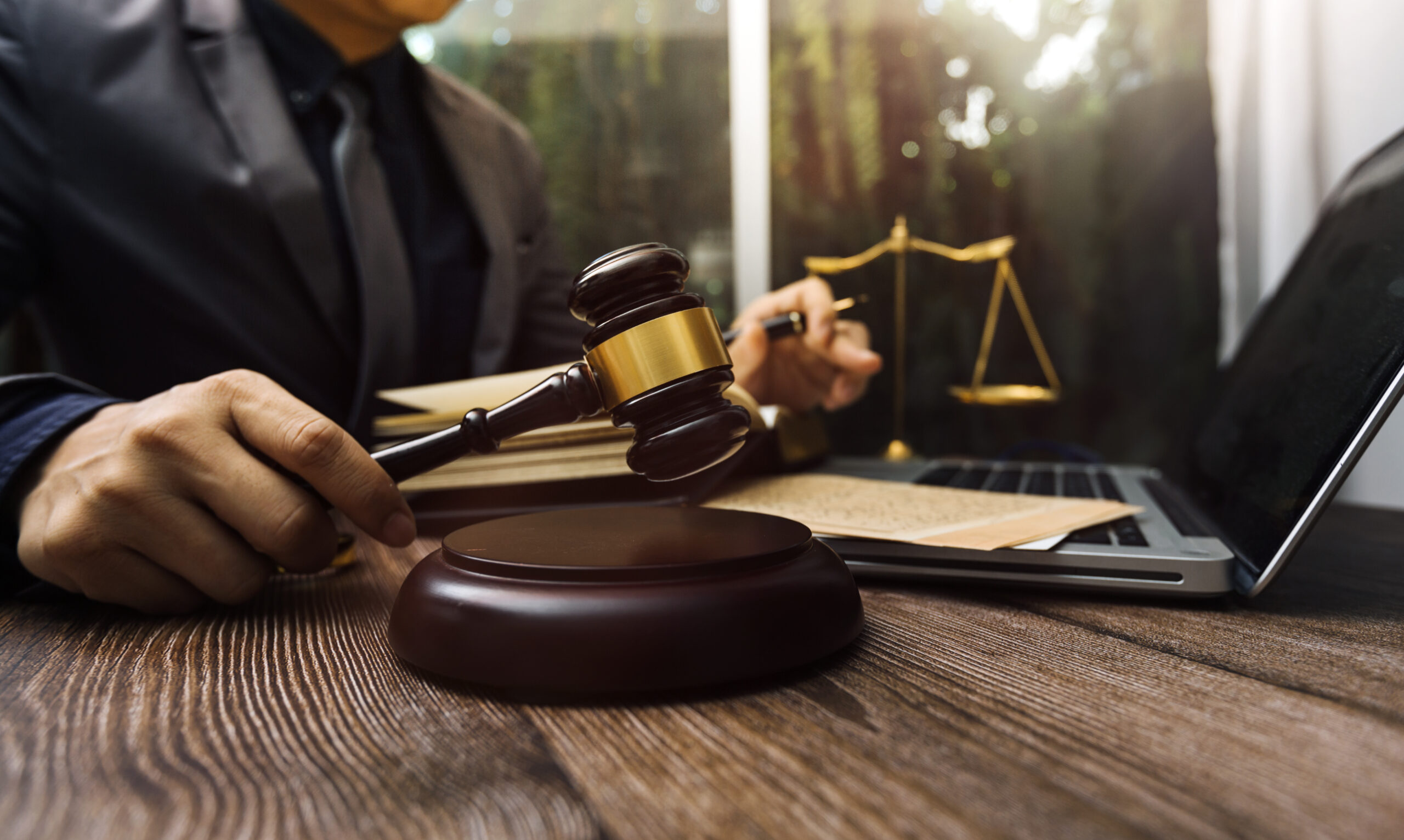 Justice and law concept.Male judge in a courtroom with the gavel
